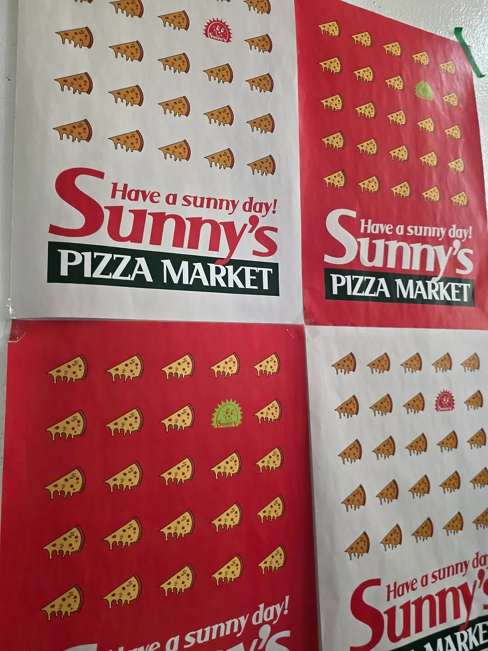 Vertical photo showing the Sunny's Pizza Market sign