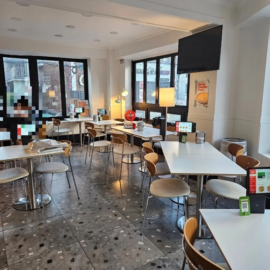 Bright white interior of Sunny's Pizza Market