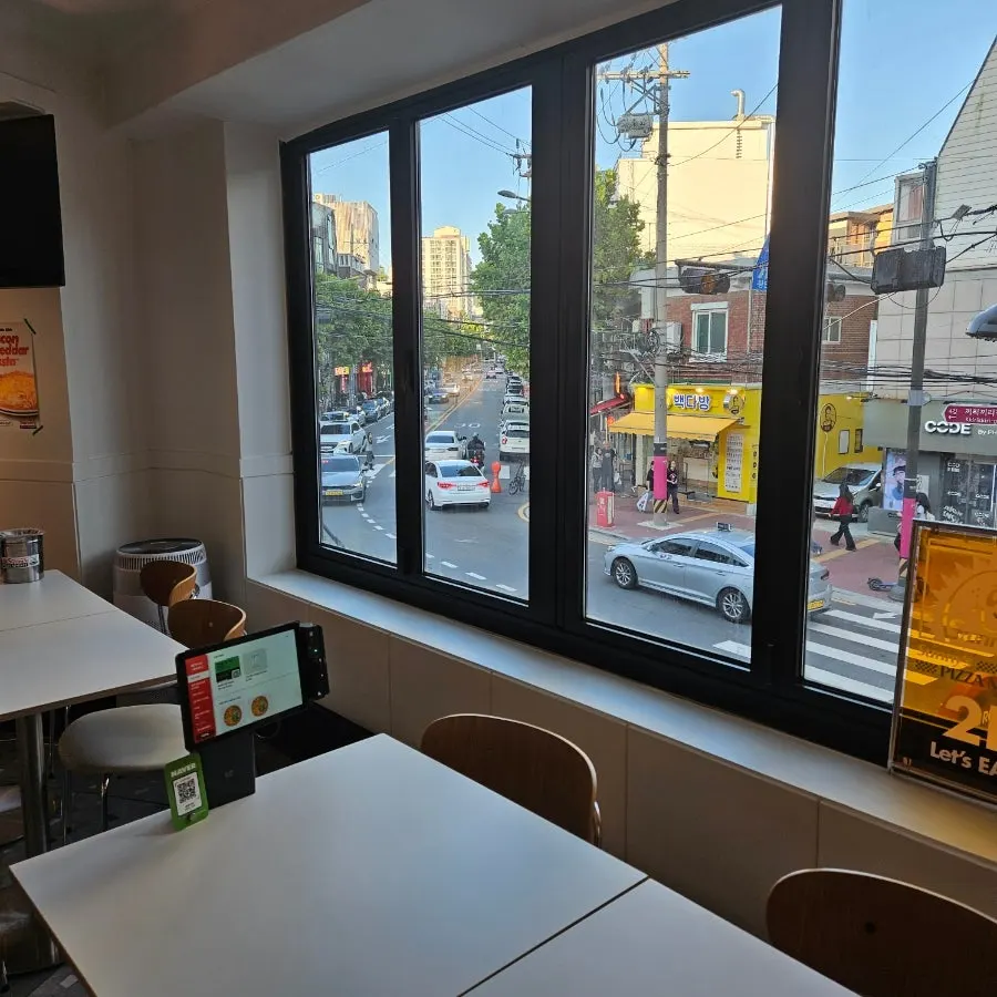 Seating at Sunny's Pizza Market with a view out the window