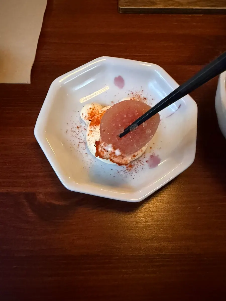 A large whole piece of white pollack roe on top