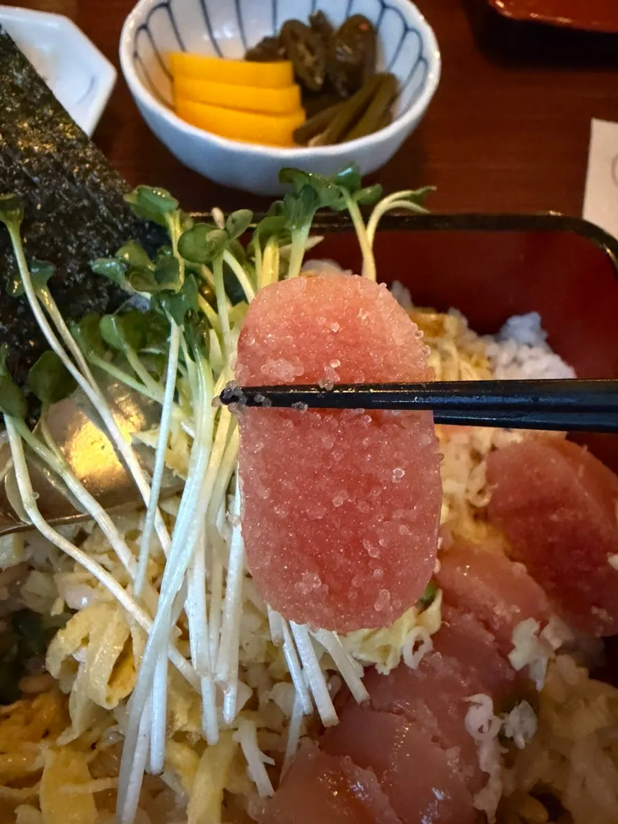 A single piece of cod roe dipped in mayo sauce