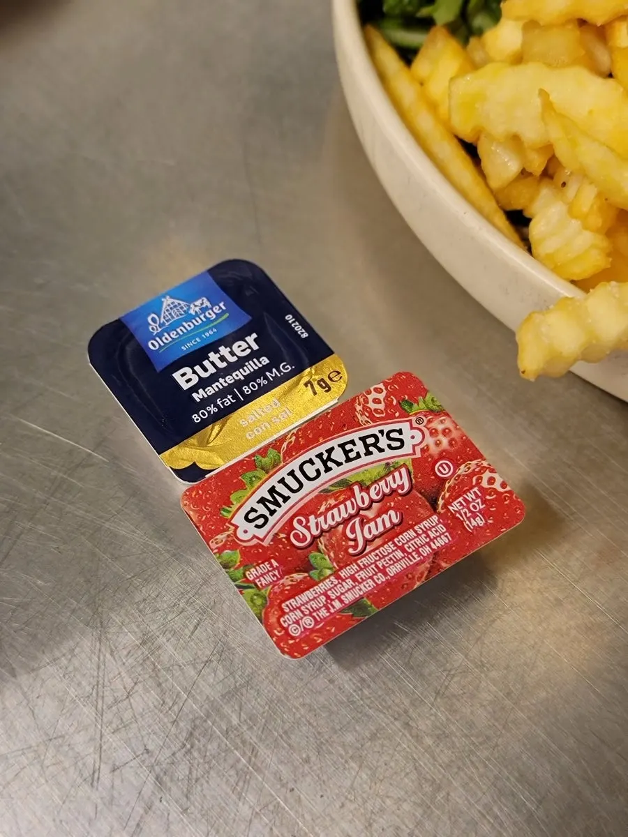 Bread served with butter and jam