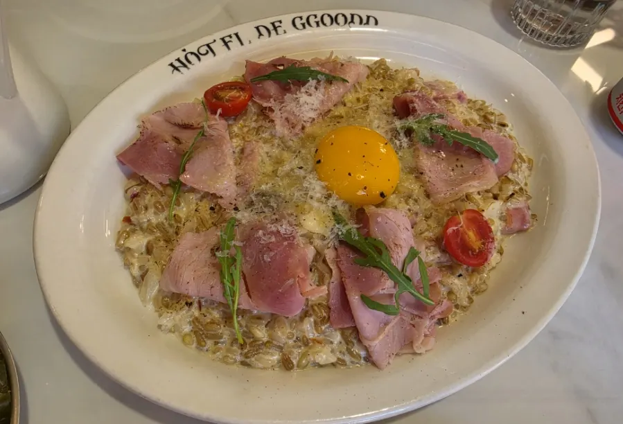 A spoonful of risotto lifted, showing the blended cream sauce