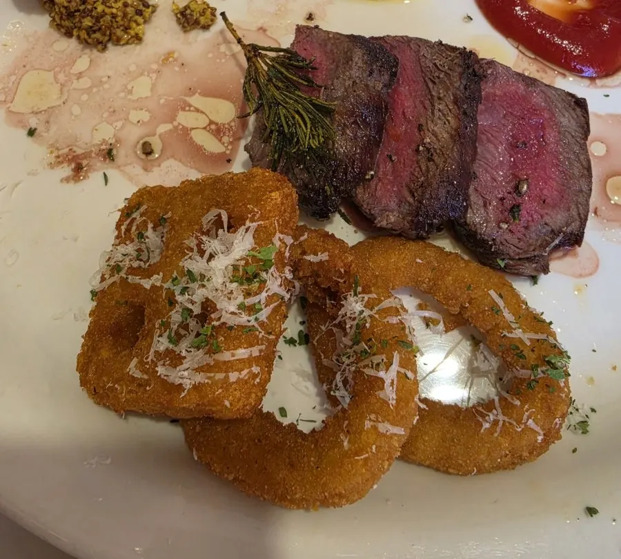 Risotto and steak placed together on the table