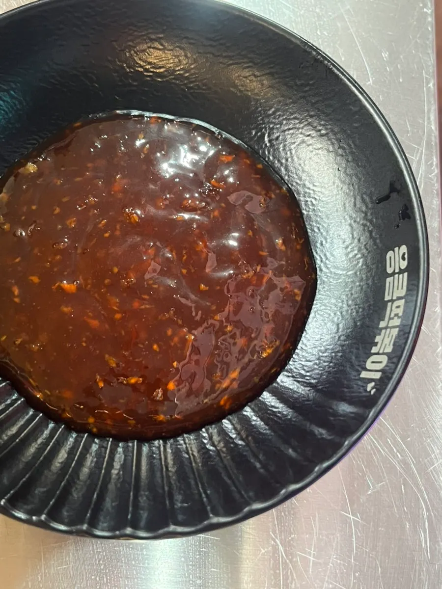 Seasoning sauce served alongside the chicken