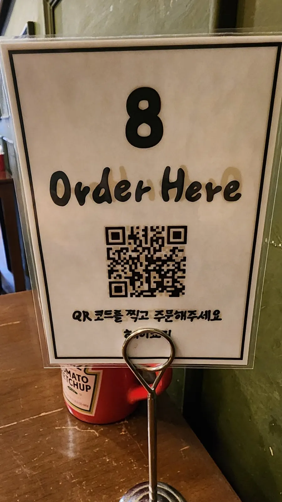 Vertical photo with ordering information at Hey Joji