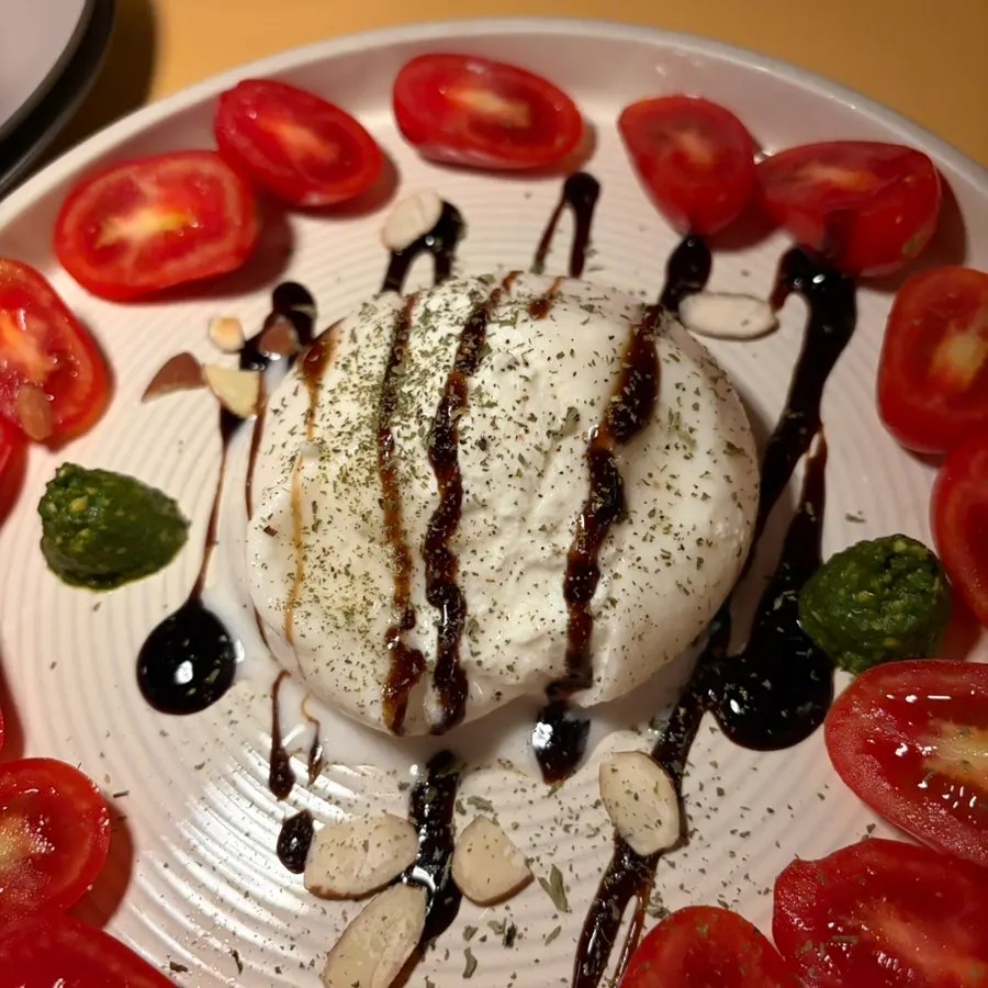 Cross-section of burrata cheese with creamy filling spilling out