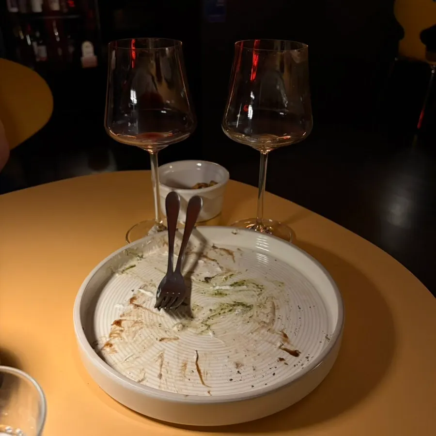Wine glasses and snacks on the table at Yozeum