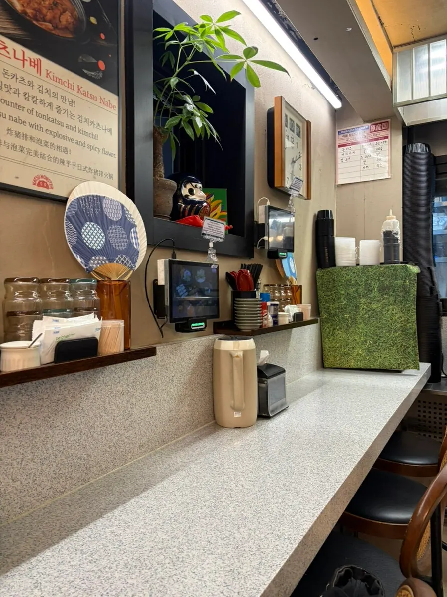 Restaurant interior with wood-toned tables