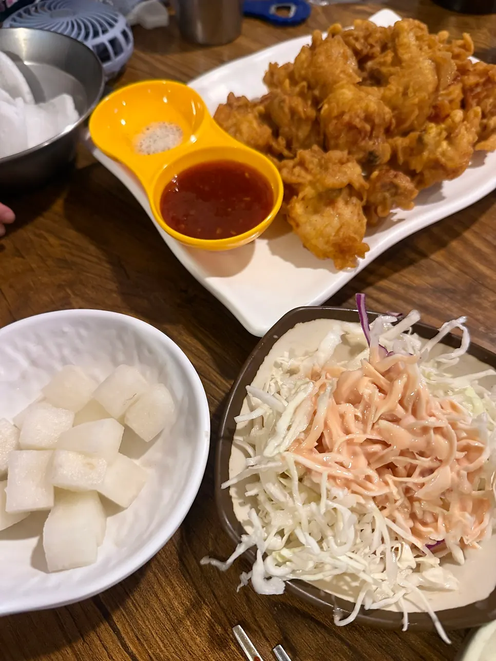 A plate of chicken stew served on the side