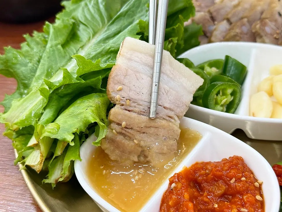 Small dishes of ssamjang and house-made garlic sauce