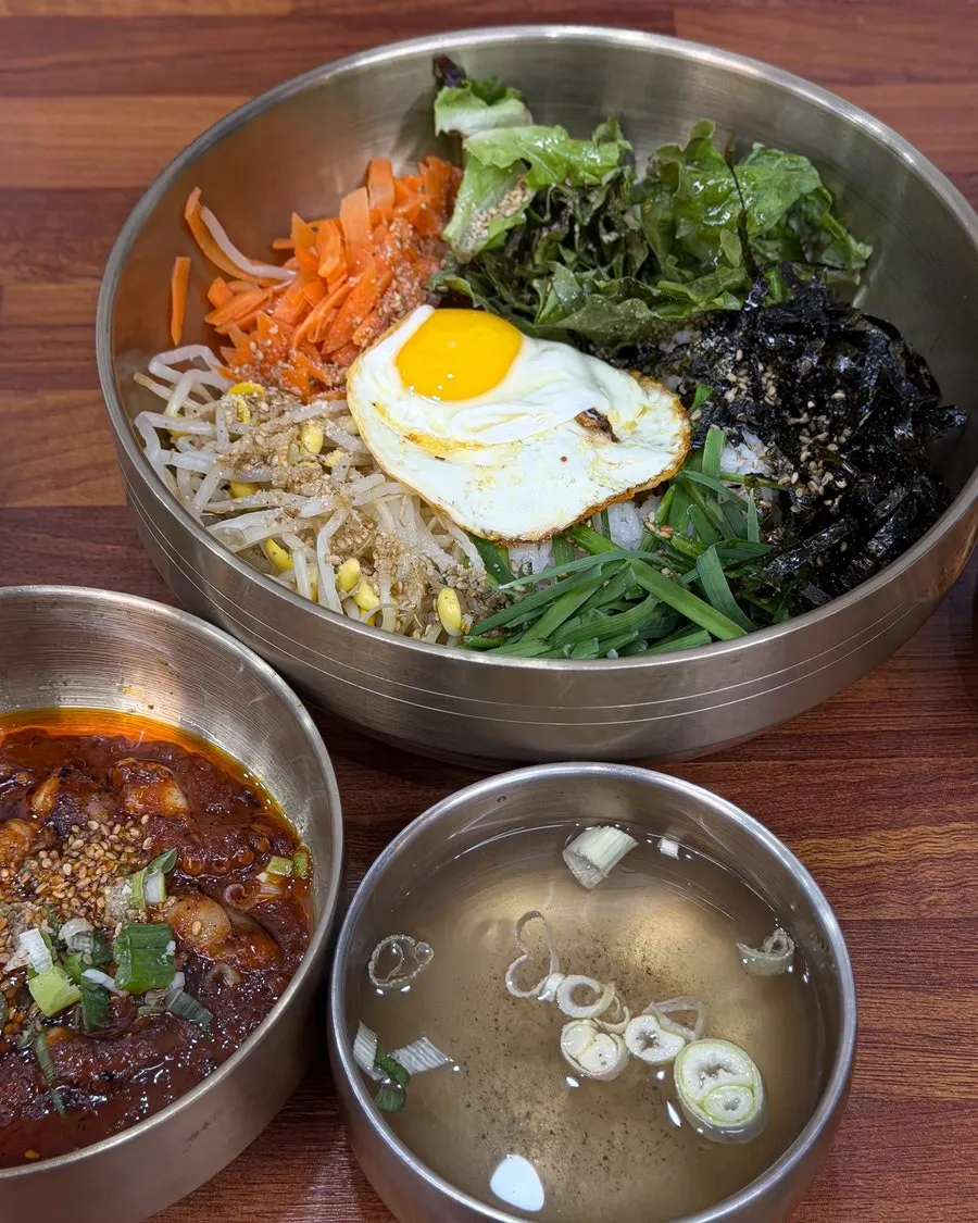 Octopus bibimbap with sauce served on the side