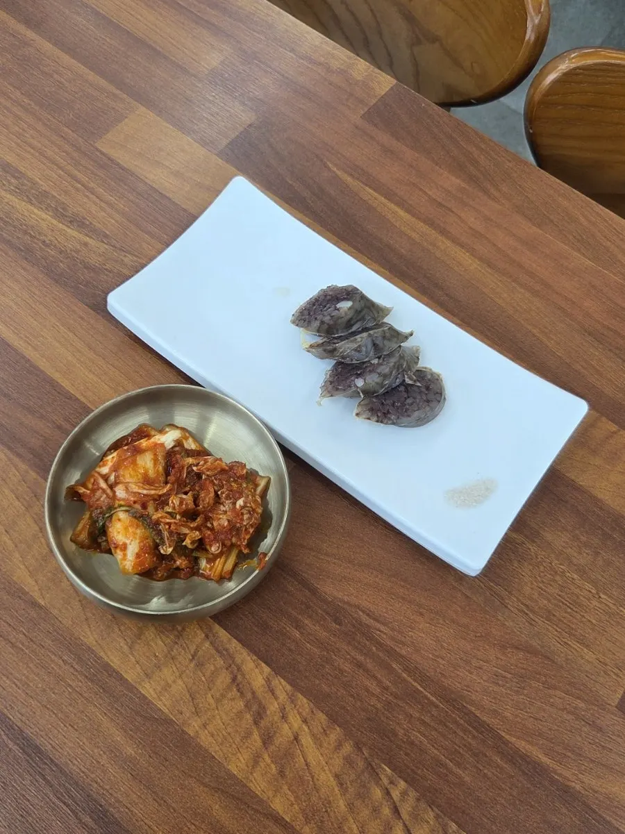 Kimchi and warm sundae served as basic side dishes