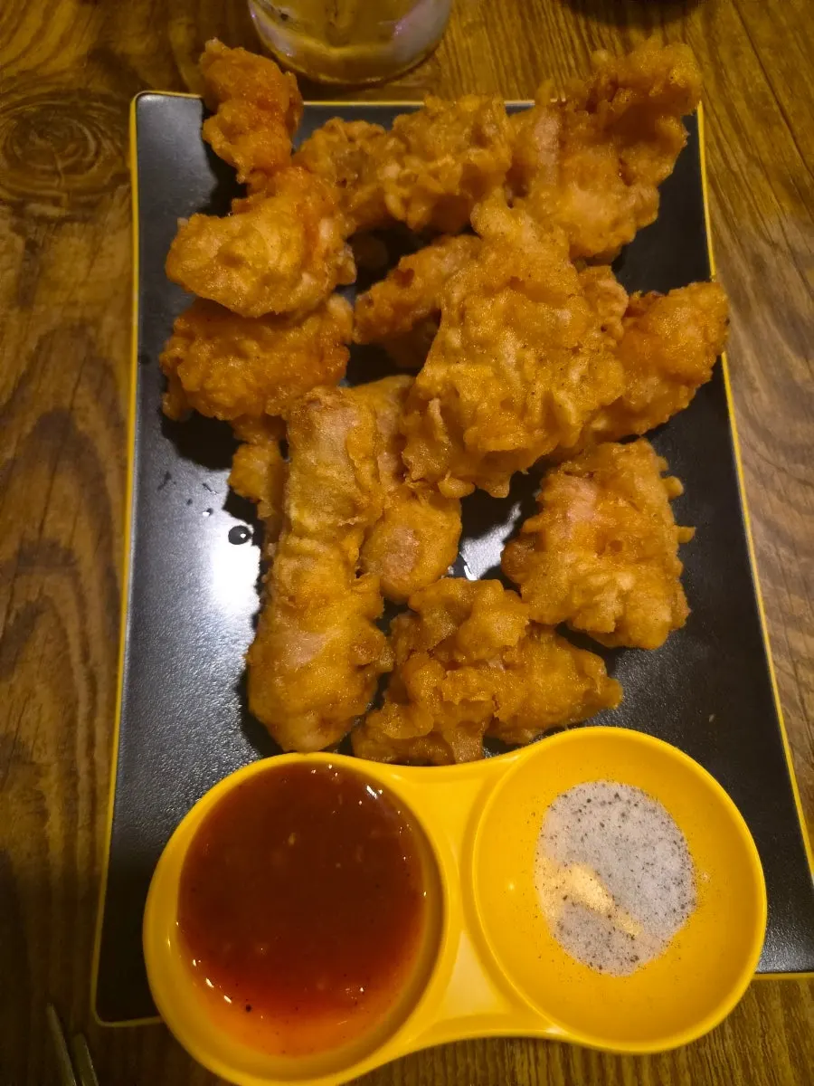 Chicken pieces and spicy broth in the dakdoritang