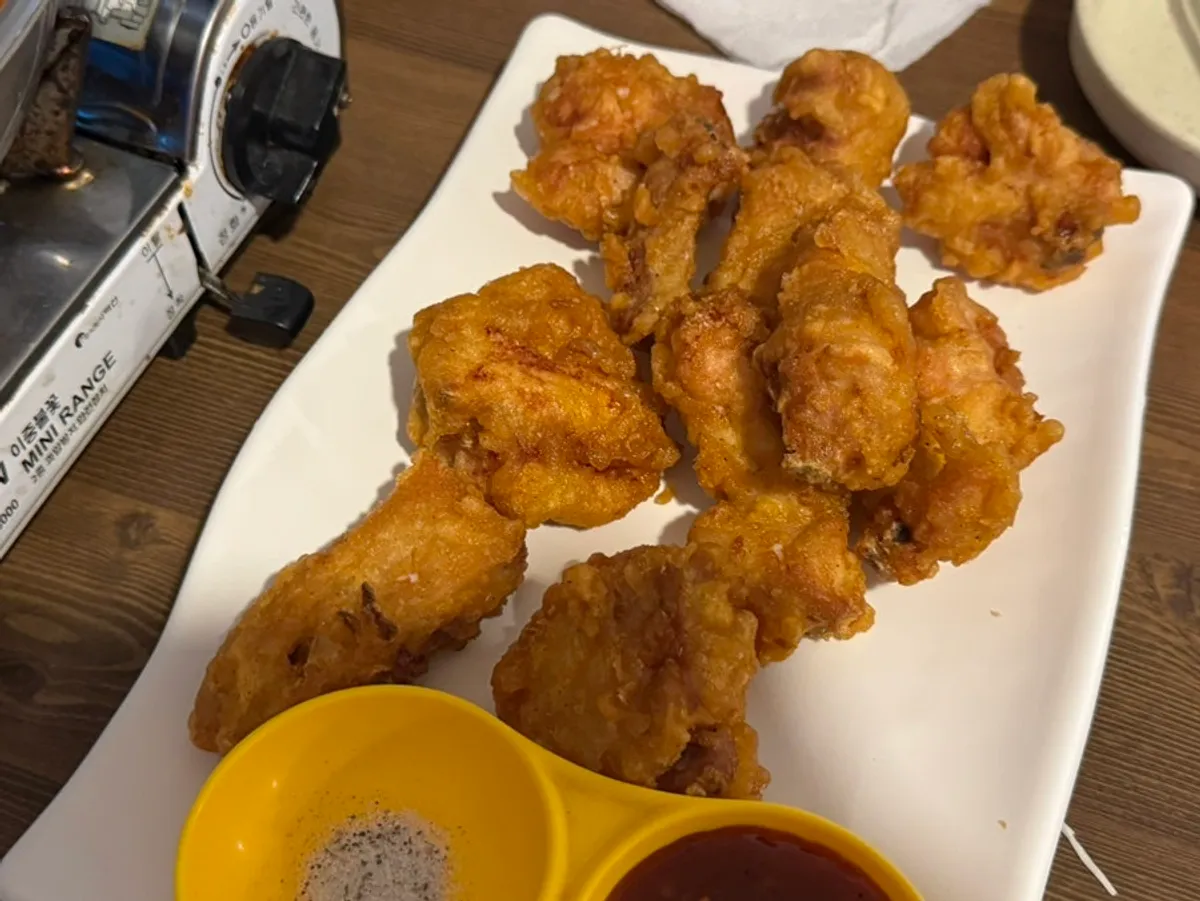 Table spread of one chicken stew and half a fried chicken, the Aentang combo
