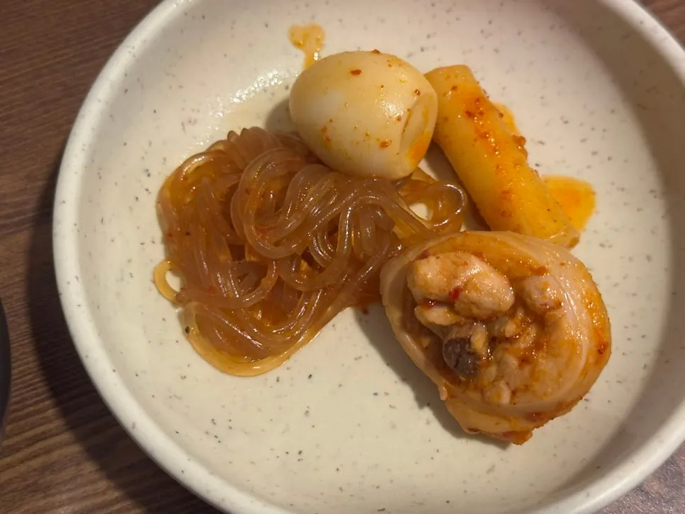 Chicken stew with glass noodles, rice cakes, and quail eggs