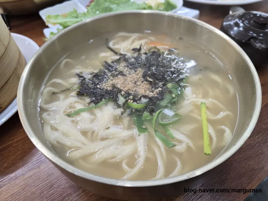 Kalguksu noodles lifted with chopsticks