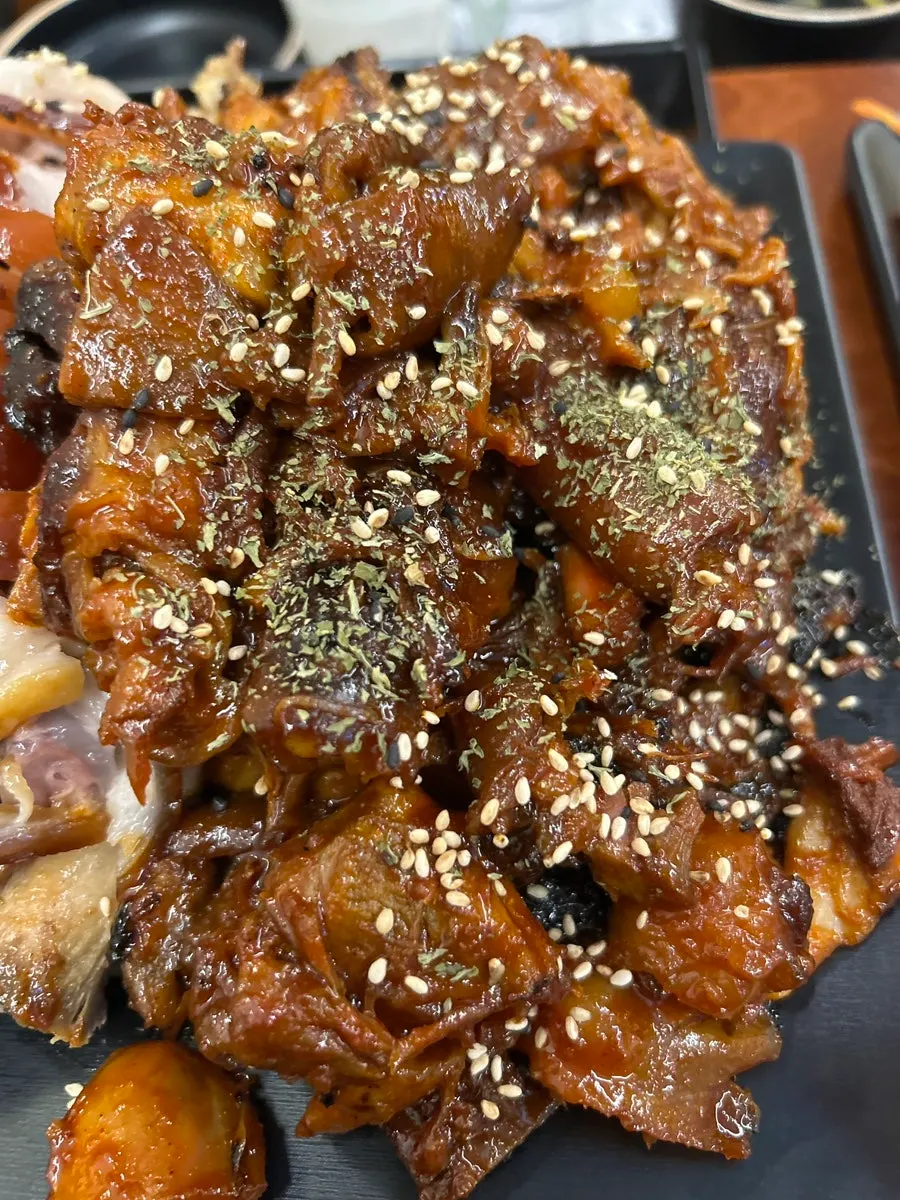Spicy jokbal topped with seasoning