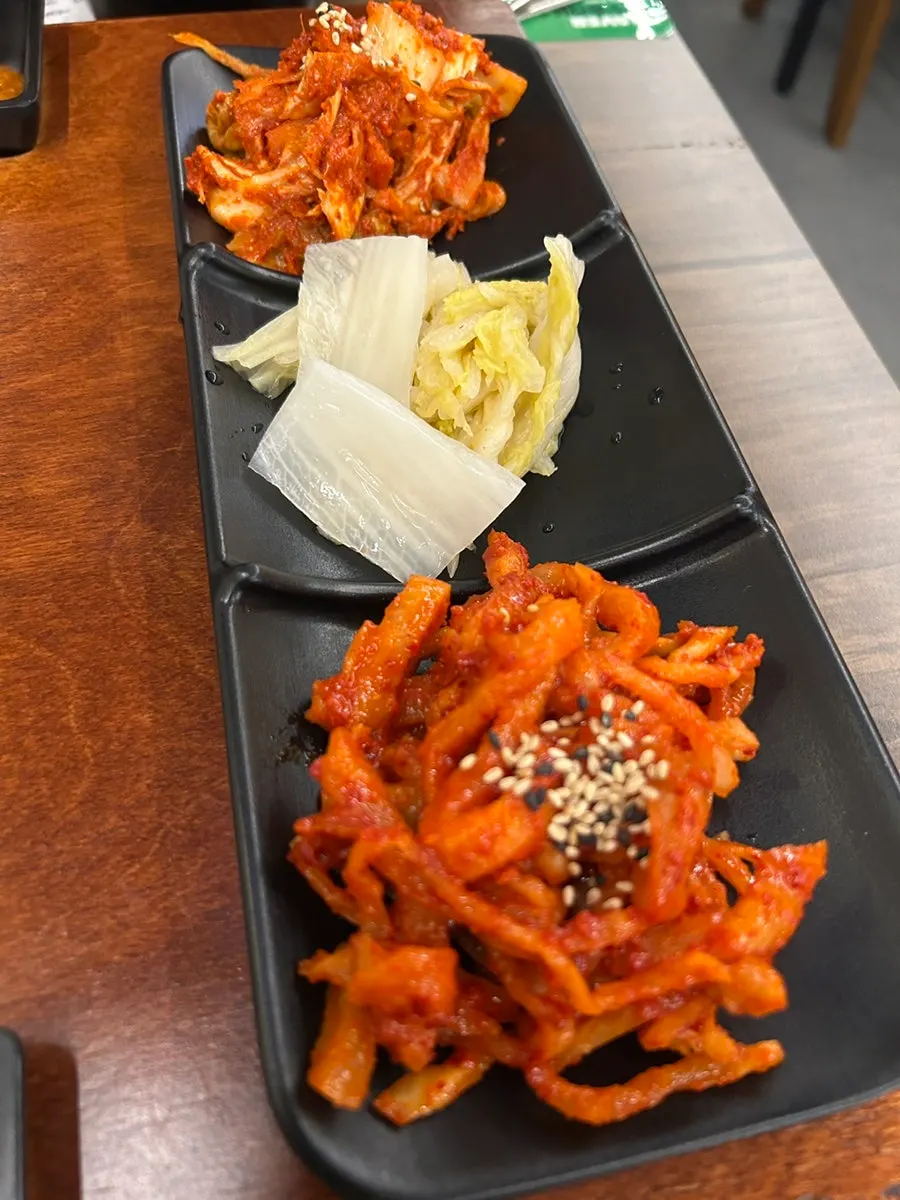 Half-eaten plate of half-and-half jokbal