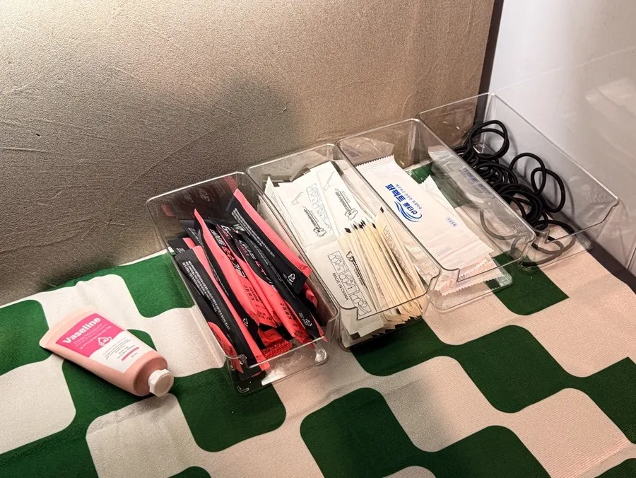 Amenity corner with floss, mouthwash, hair ties, and hand cream