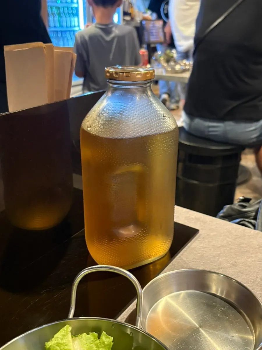 Barley tea served in a glass bottle