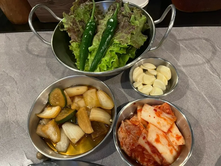 Table setting with hygienically wrapped utensils and water cups