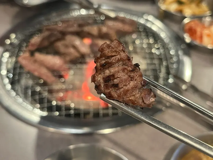 Grilled beef ribs with accompanying side dishes