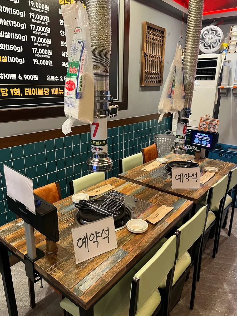 Interior seating with 4-person tables at Sambaek Hanu Daecheop