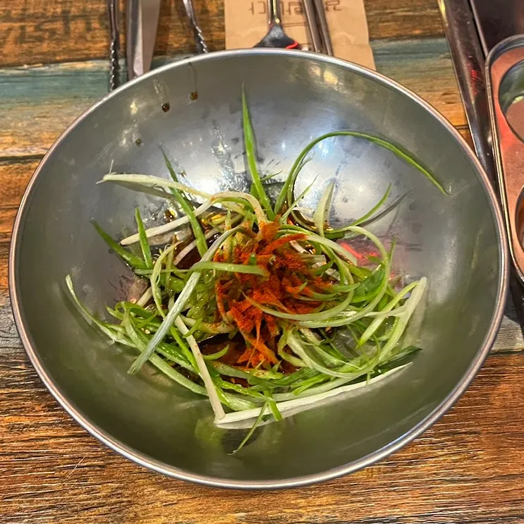 Close-up of side dish plates at the BBQ restaurant