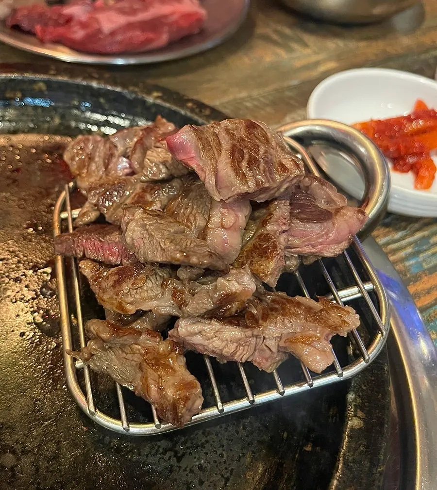 Close-up of the sirloin cooking on the stone plate