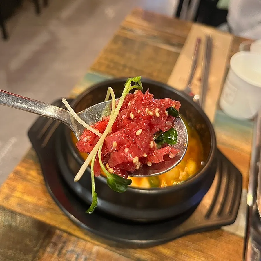 Grilled sirloin moved onto a mini metal plate