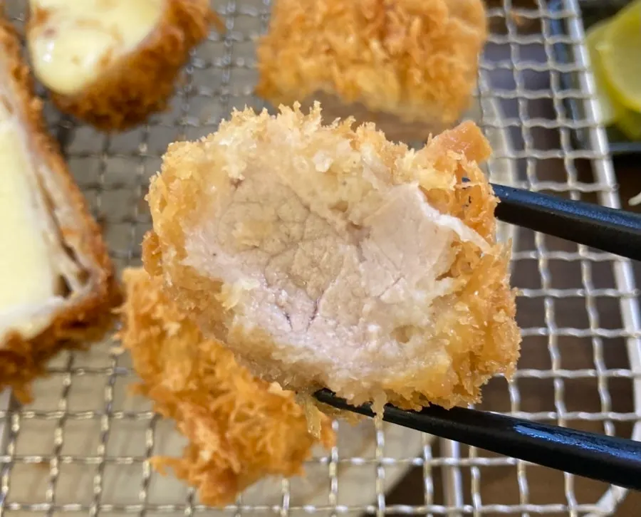 First bite of katsu dipped in salt and wasabi