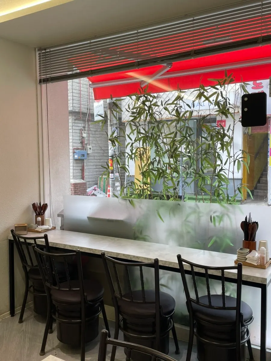 Interior of Katsu Monster Yeonsinnae Branch with mostly 2-person tables