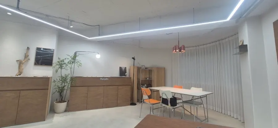 Workshop space with an orange consultation table