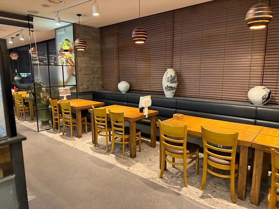 Table seating extending toward the back of the restaurant