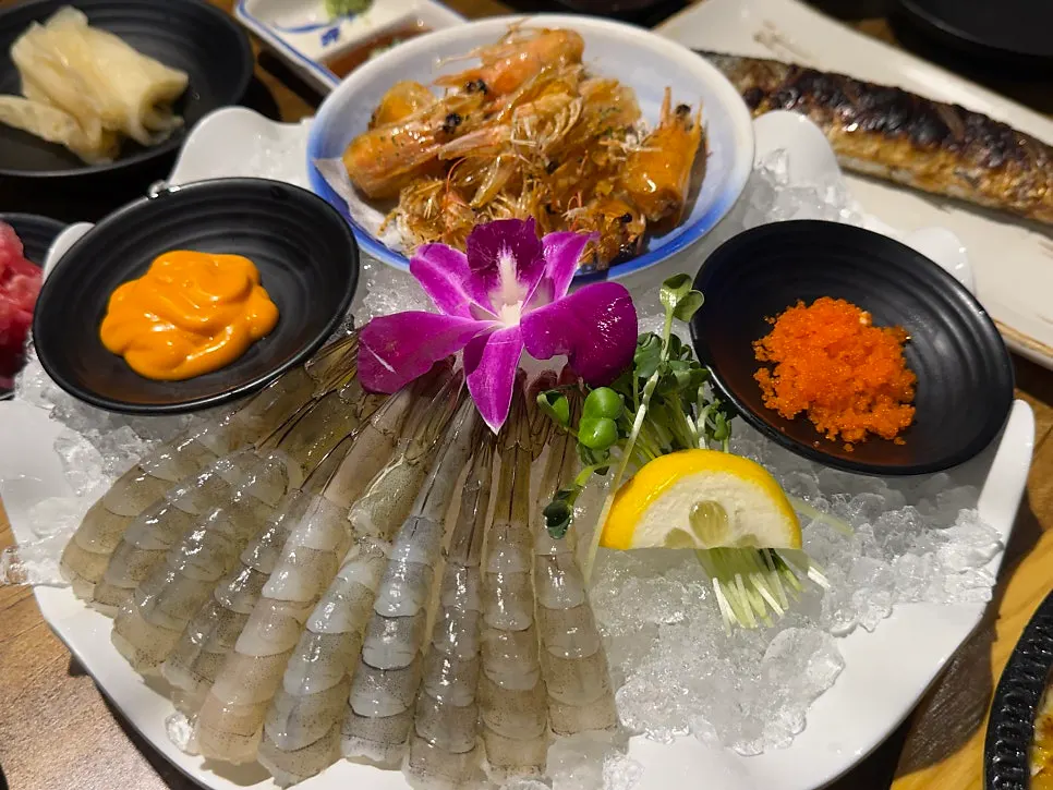 Couple's set with assorted sashimi, sushi, and grilled fish