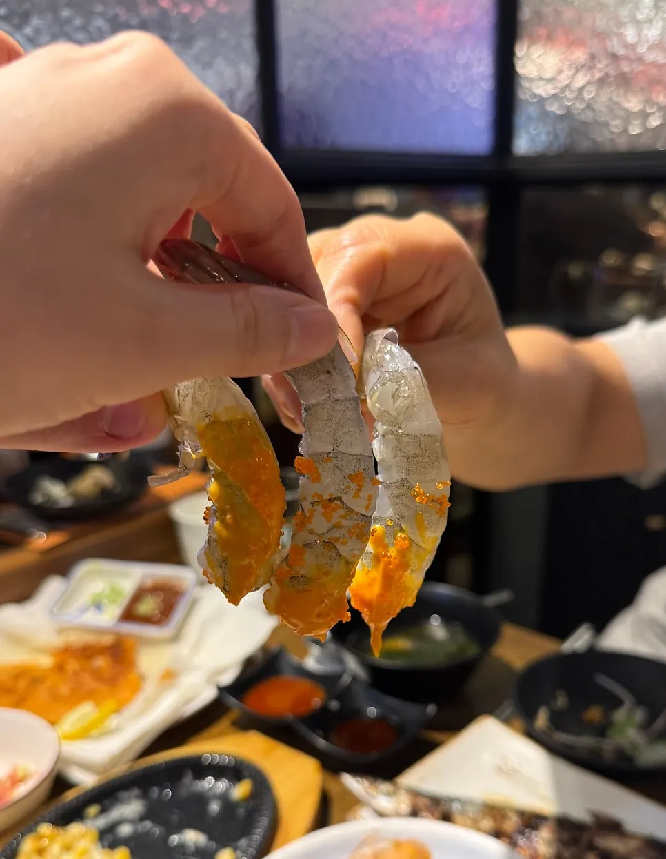 Peeled raw shrimp sashimi served with flying fish roe