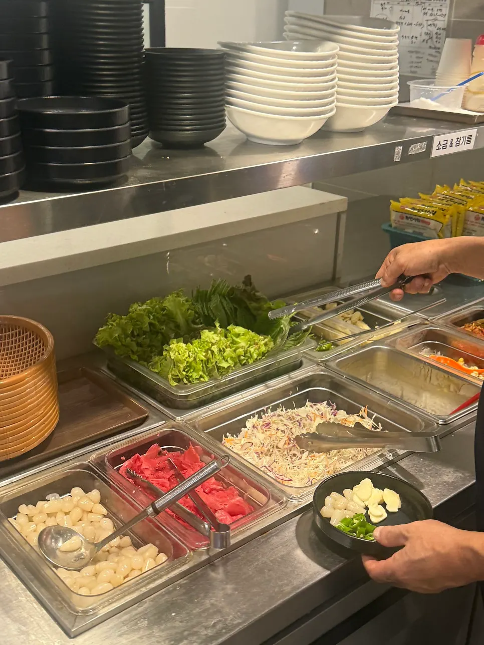 Self-serve side dish bar in the middle of the restaurant