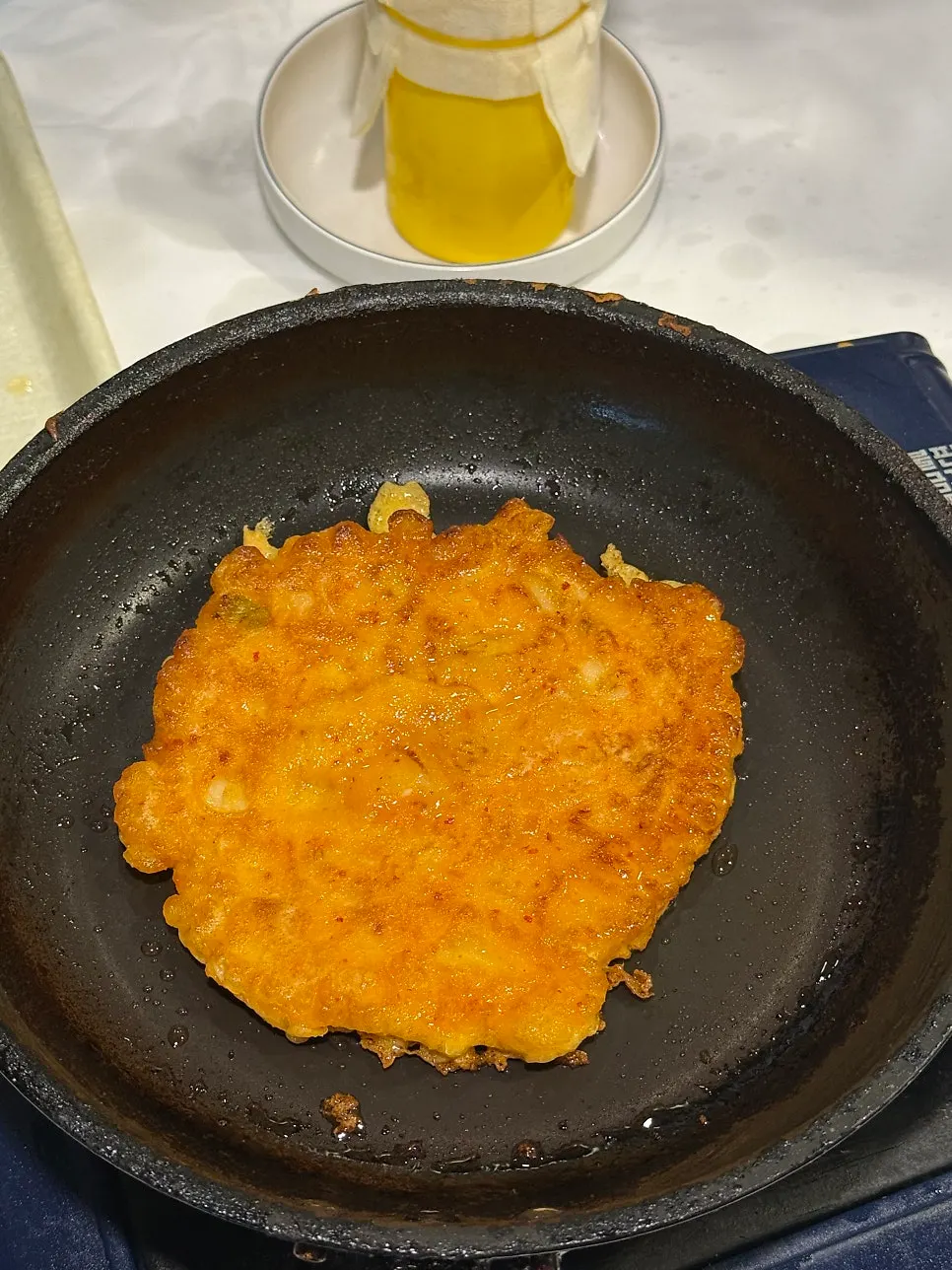 A plate of crispy grilled kimchi pancake