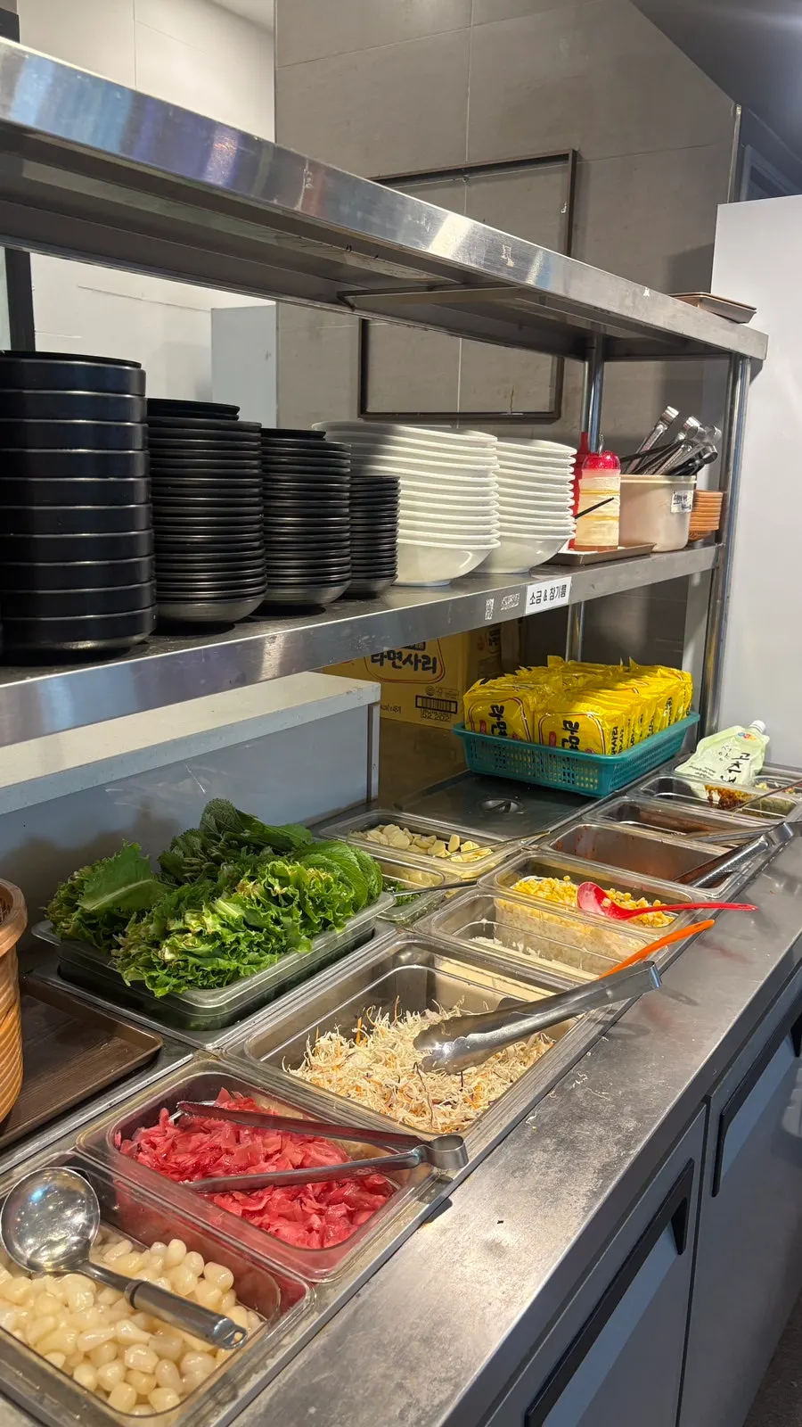 Self-serve bar with white kimchi and lettuce wraps