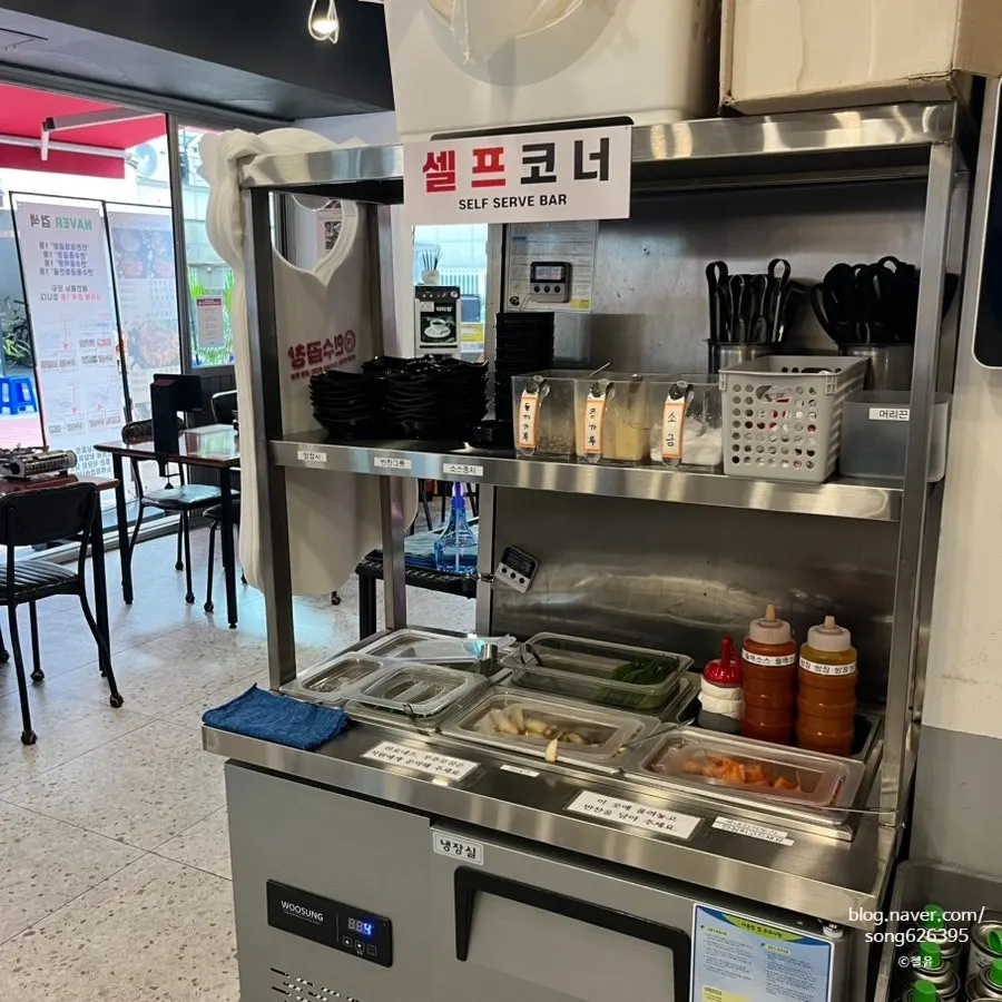 Inside Yeonsu Gopchang, with open tables near the door