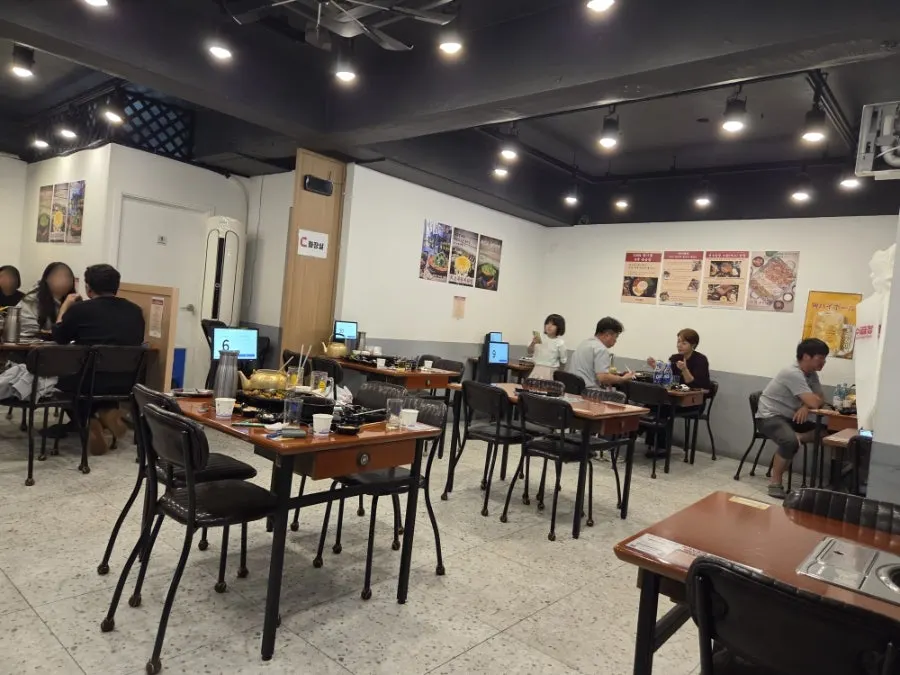 Retro-style interior seating at Yeonsu Gopchang