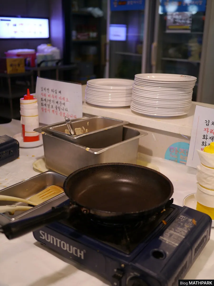 Self-serve bar filled with various sauces and side dishes