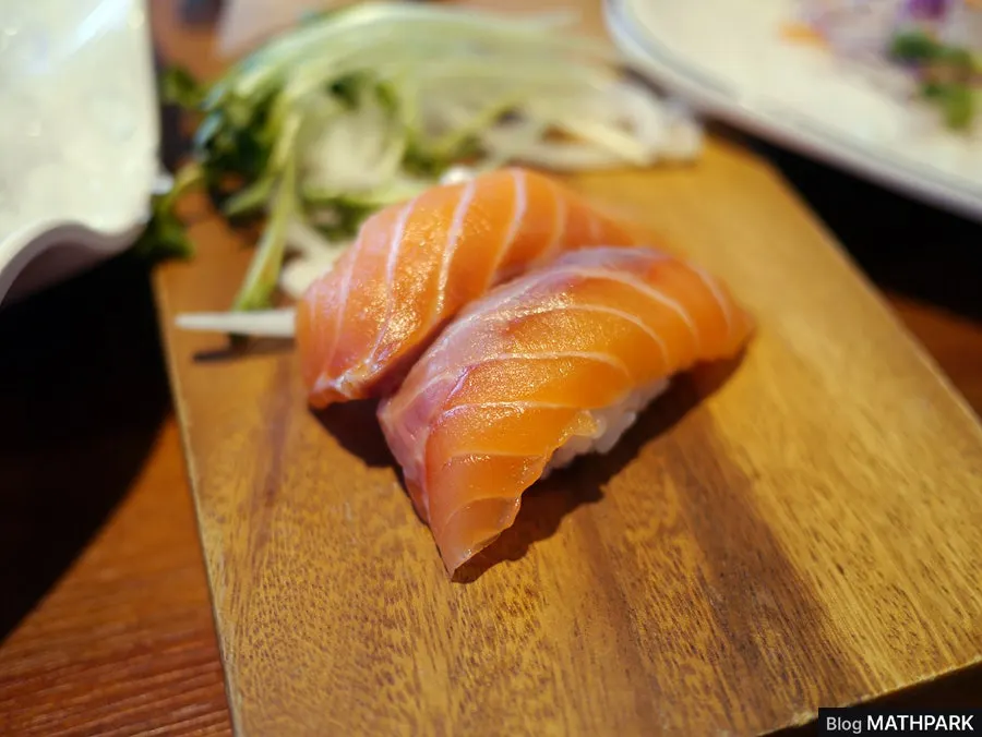 Picking up a piece of sashimi