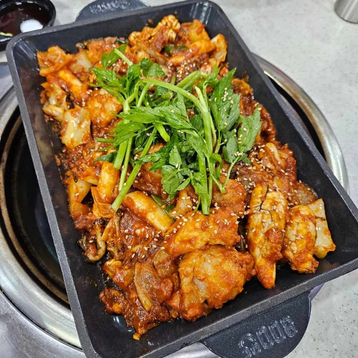 Full table setting of boneless anglerfish stew