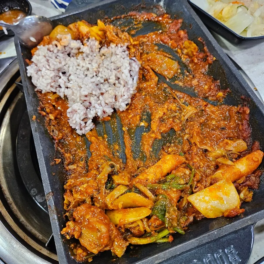 Rice mixed into the leftover sauce