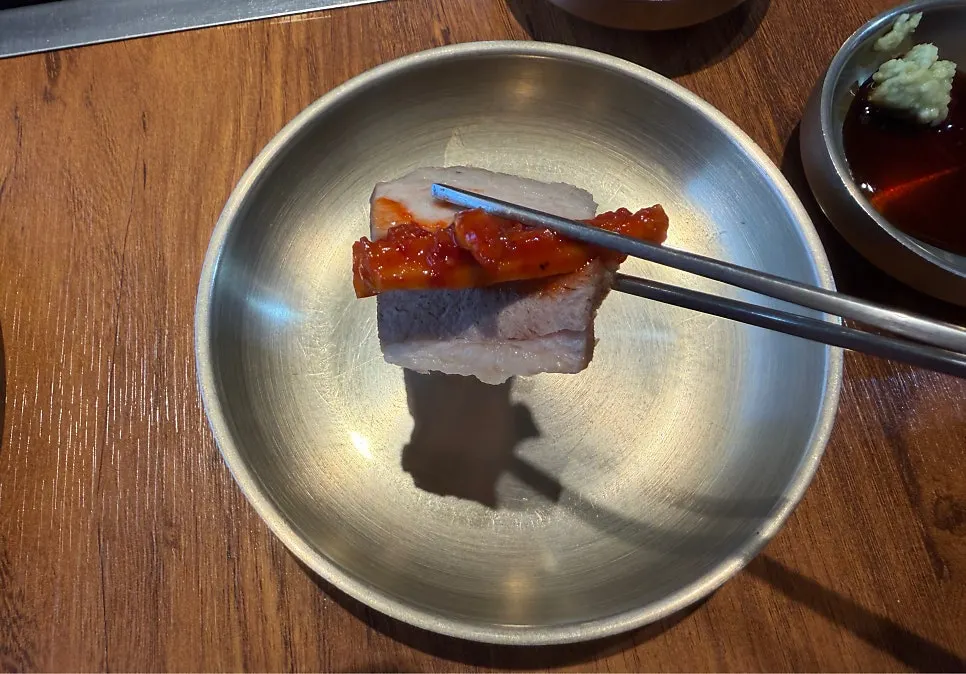 Small plate of cooked meat and vegetables