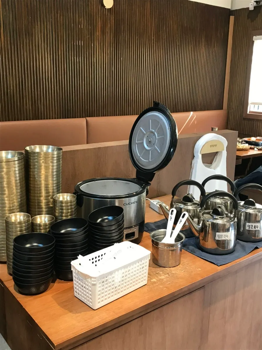 Broth, bowls, and rice at the self-bar