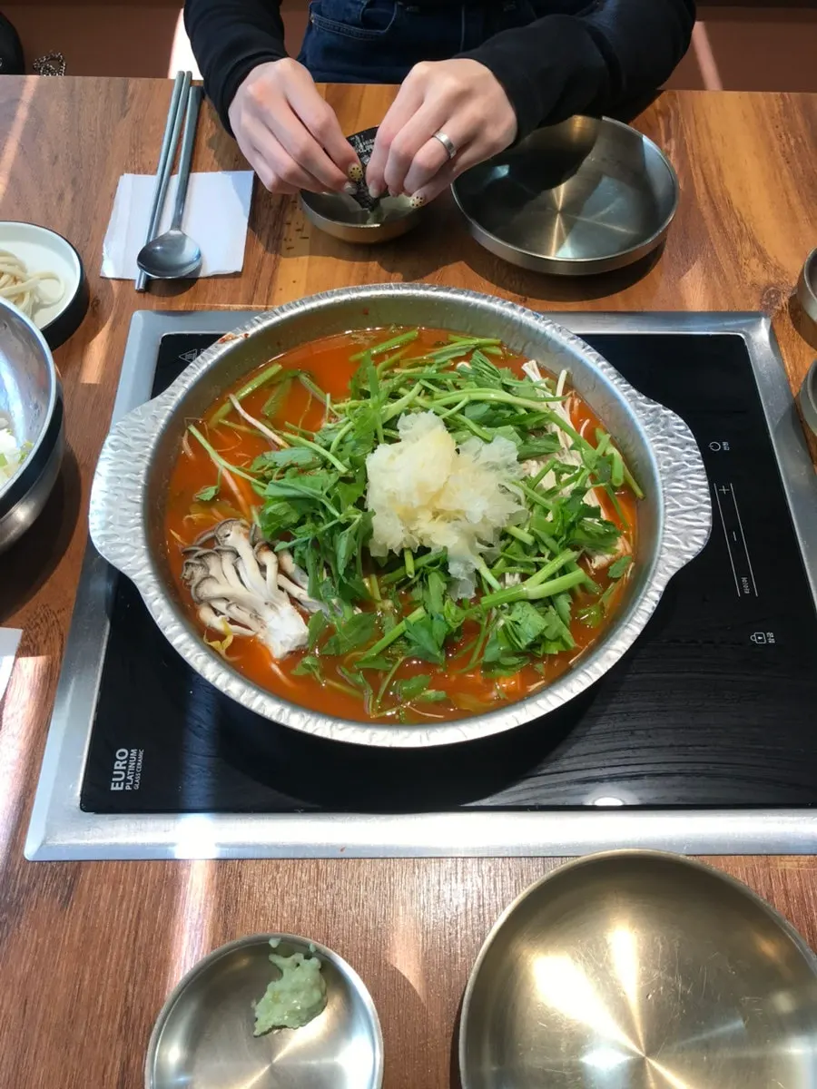 Pot of sangwhwang mushroom broth shabu kalguksu