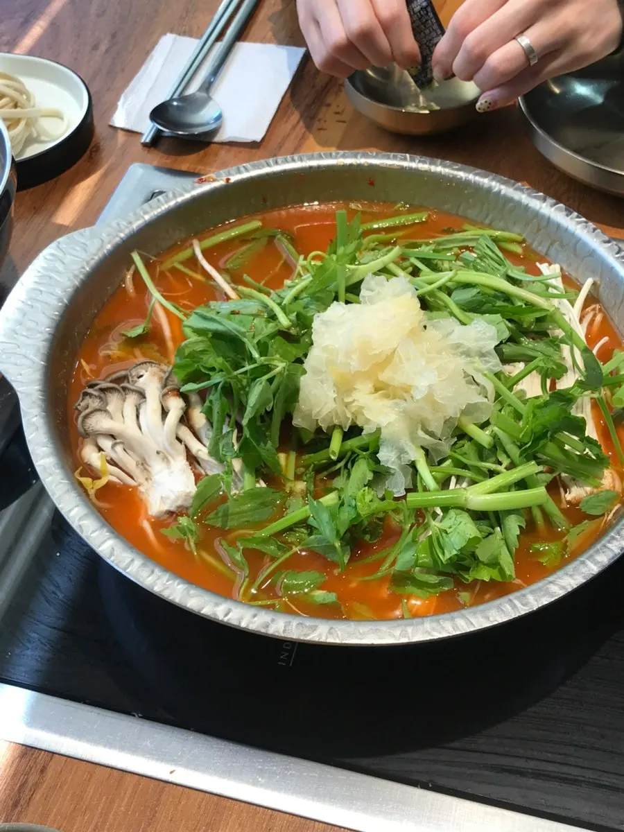 Plate of oyster mushrooms, white jelly mushrooms, and minari